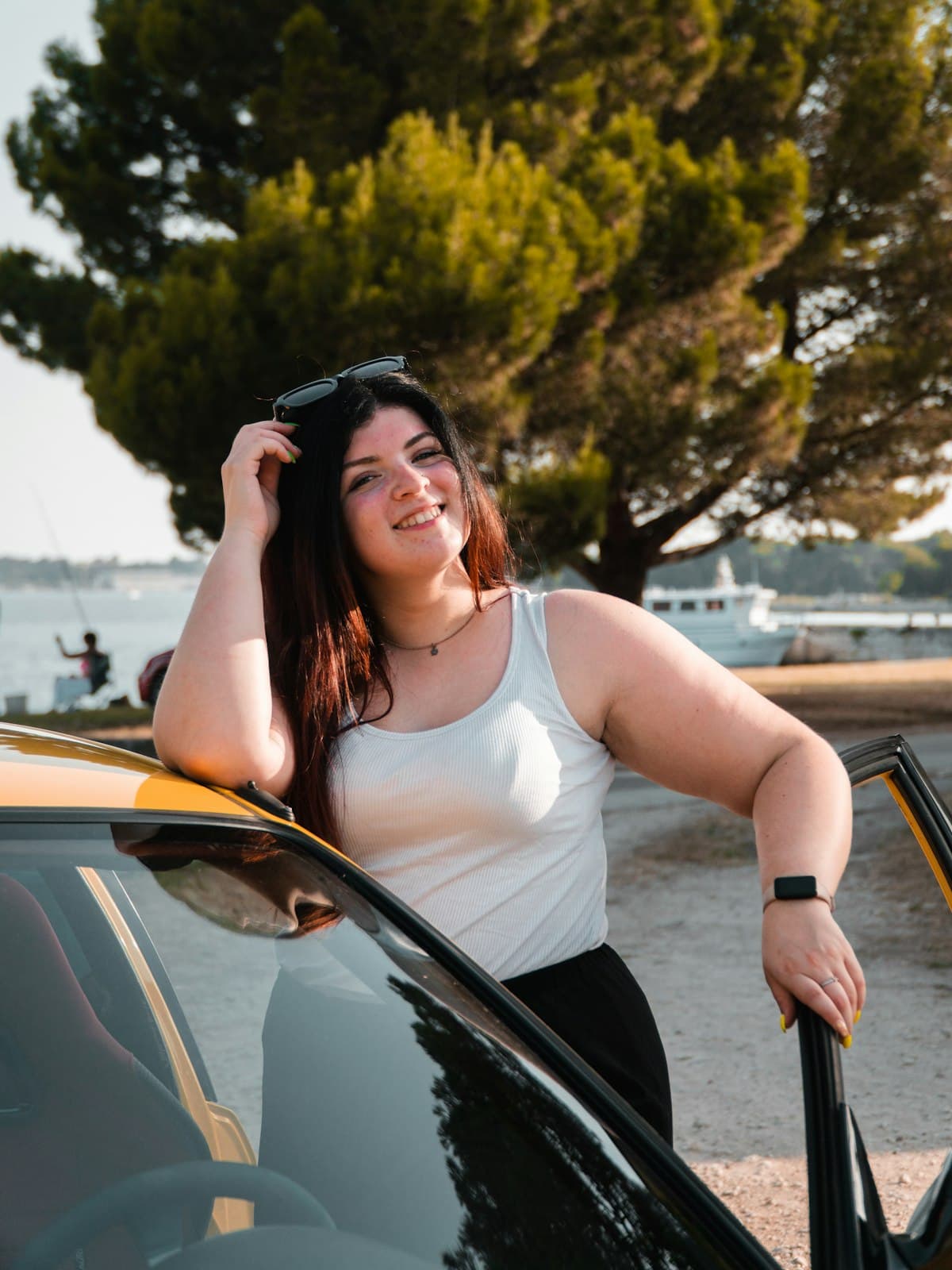 A woman standing outdoors in daylight