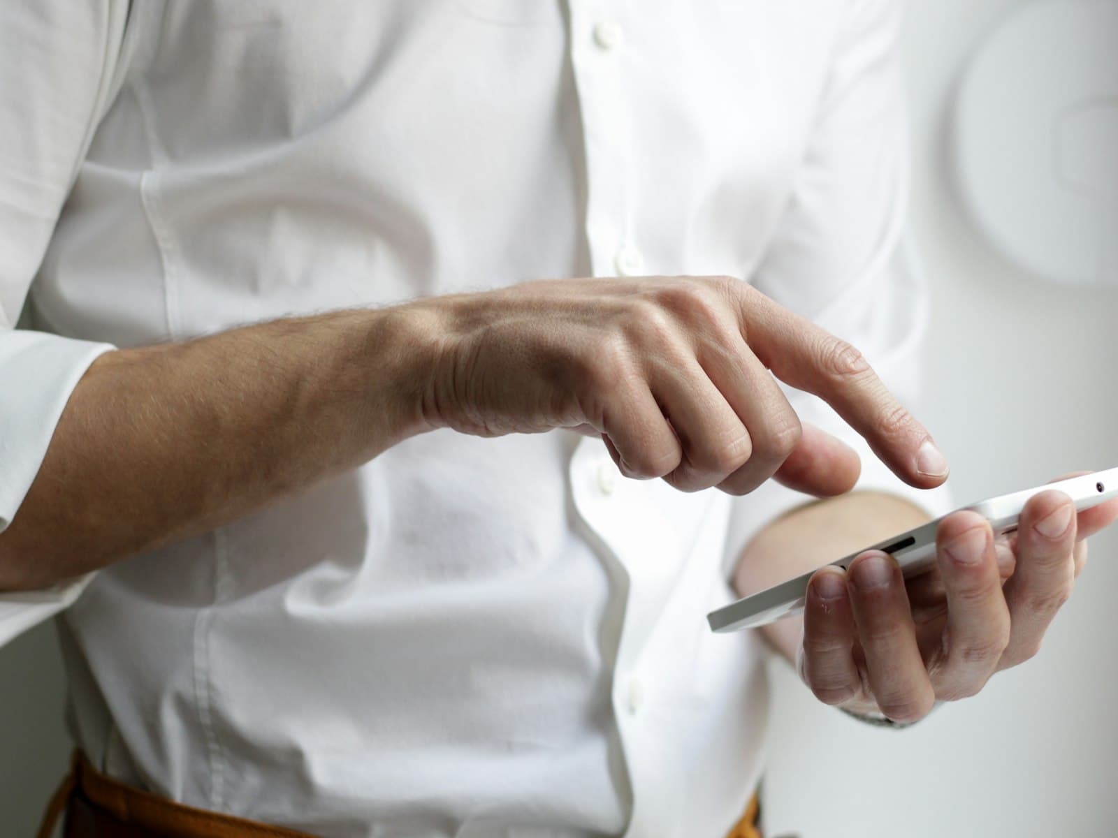 A person holding a phone, completing the online evaluation